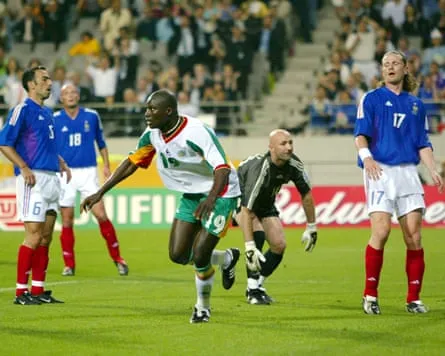 Senegal’s Papa Bouba Diop celebrates his goal against France in Seoul, South Korea, 31 May 2002