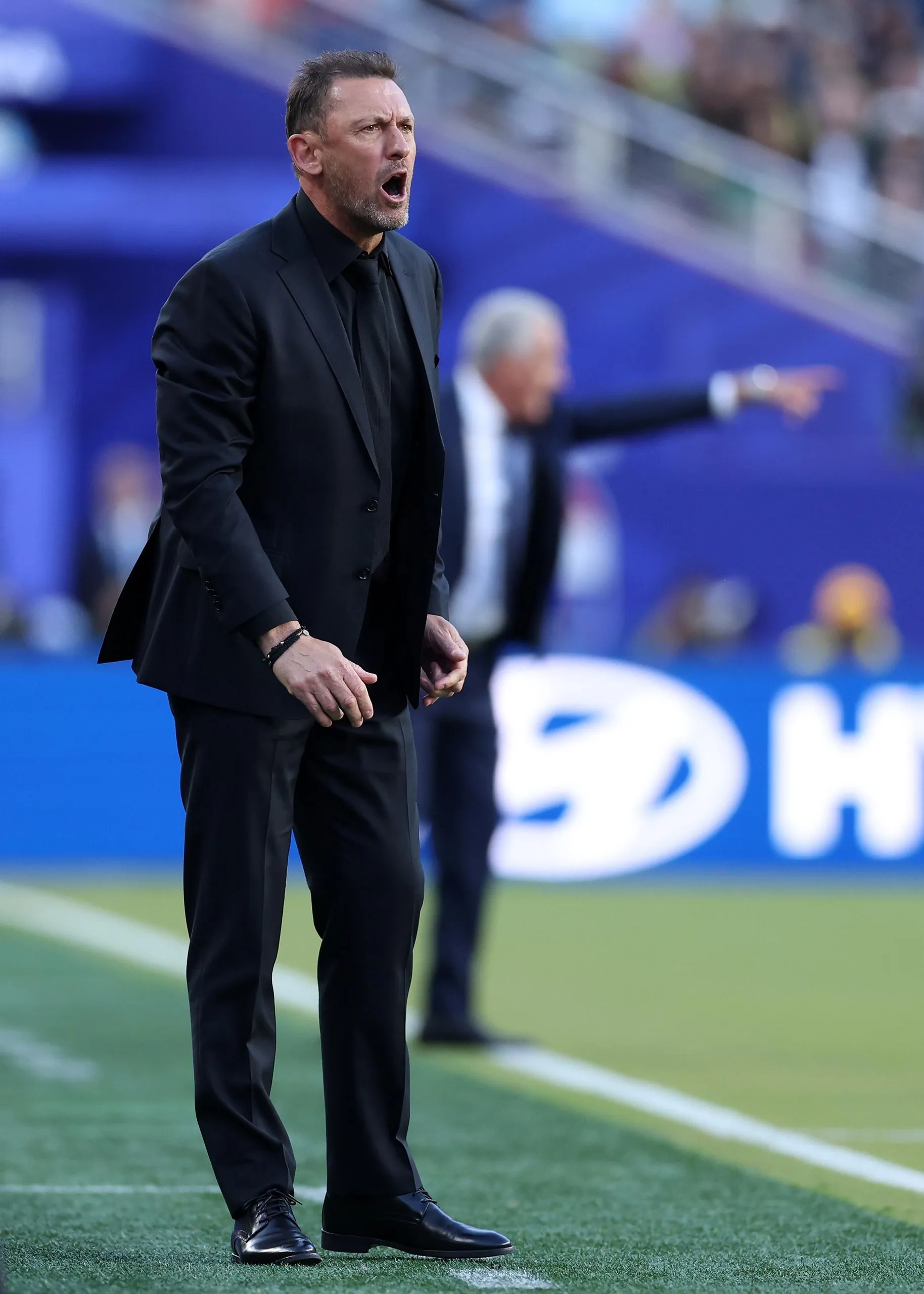 Socceroos coach Tony Popovic gets his point across.