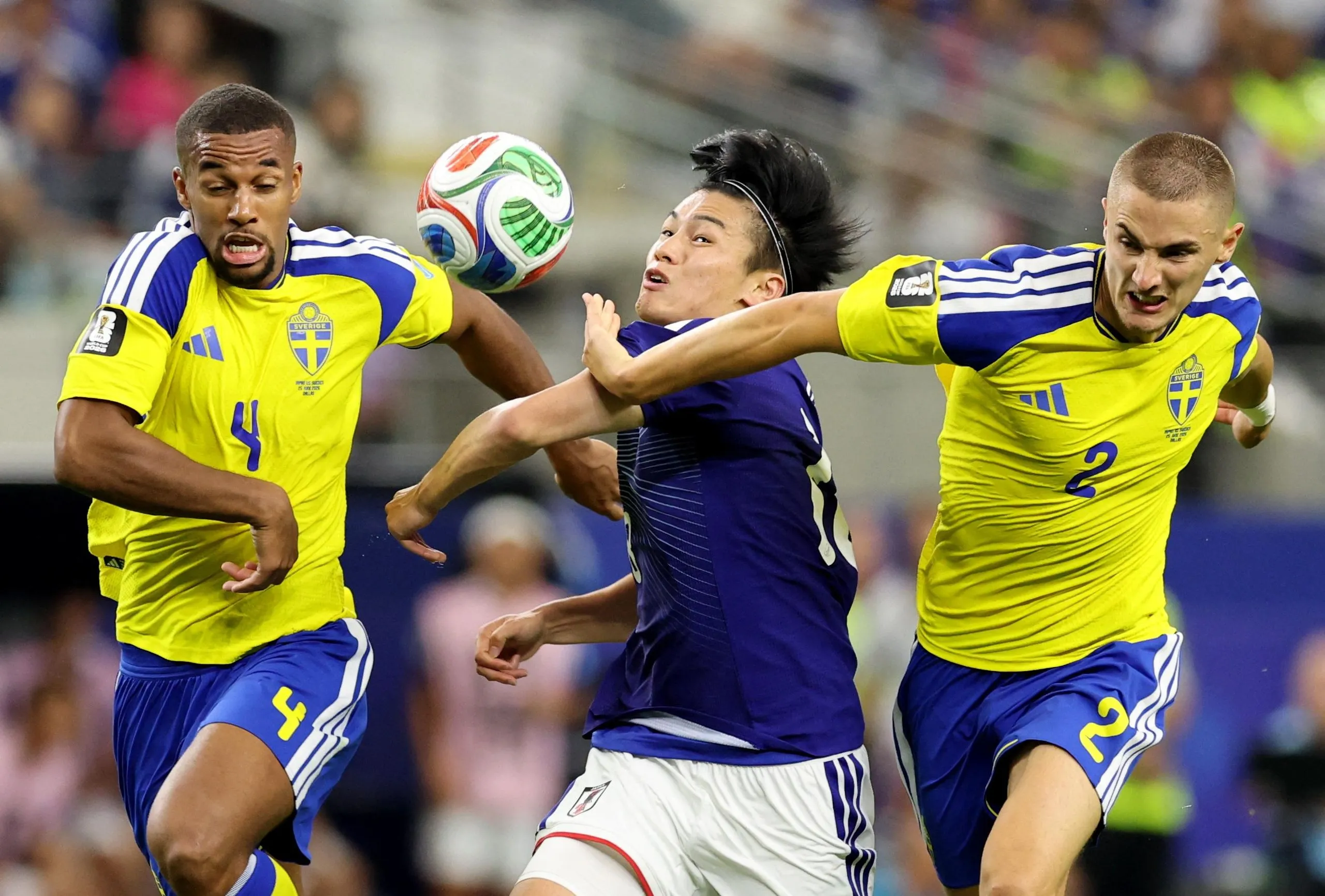Isak Hien goes into the book for a foul on Ayase Ueda.