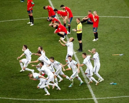 Russia celebrate winning a penalty shootout against Spain in the round of 16 in Moscow, Russia, 1 July 2018