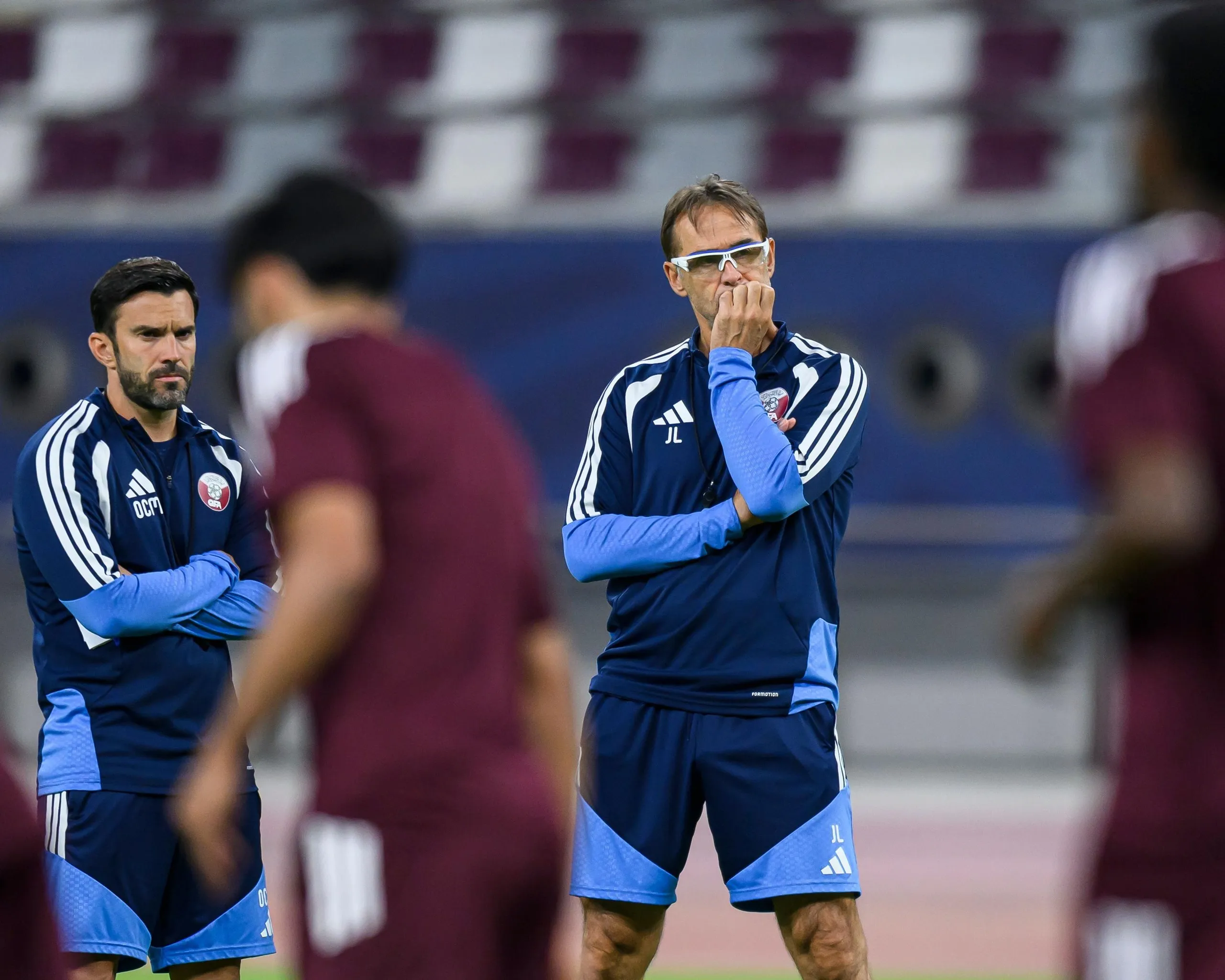 Julen Lopetegui (right), the head coach of the Qatar football team, and his assistant Oscar Caro (left) oversee a training session.