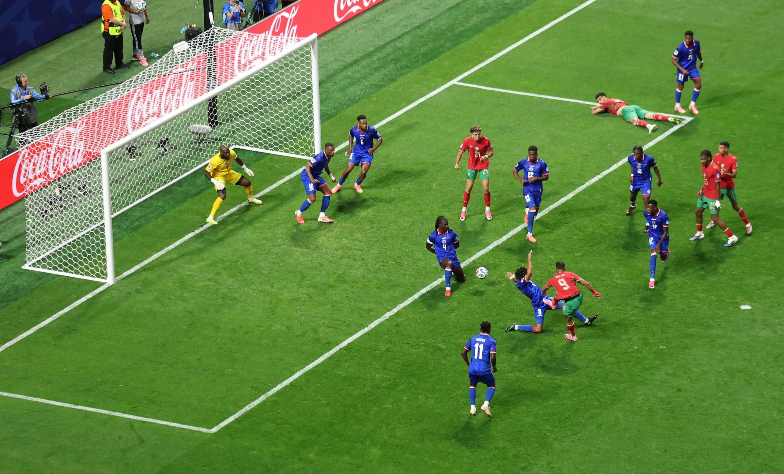 Soufiane Rahimi scores their third goal past Haiti's Johny Placide
