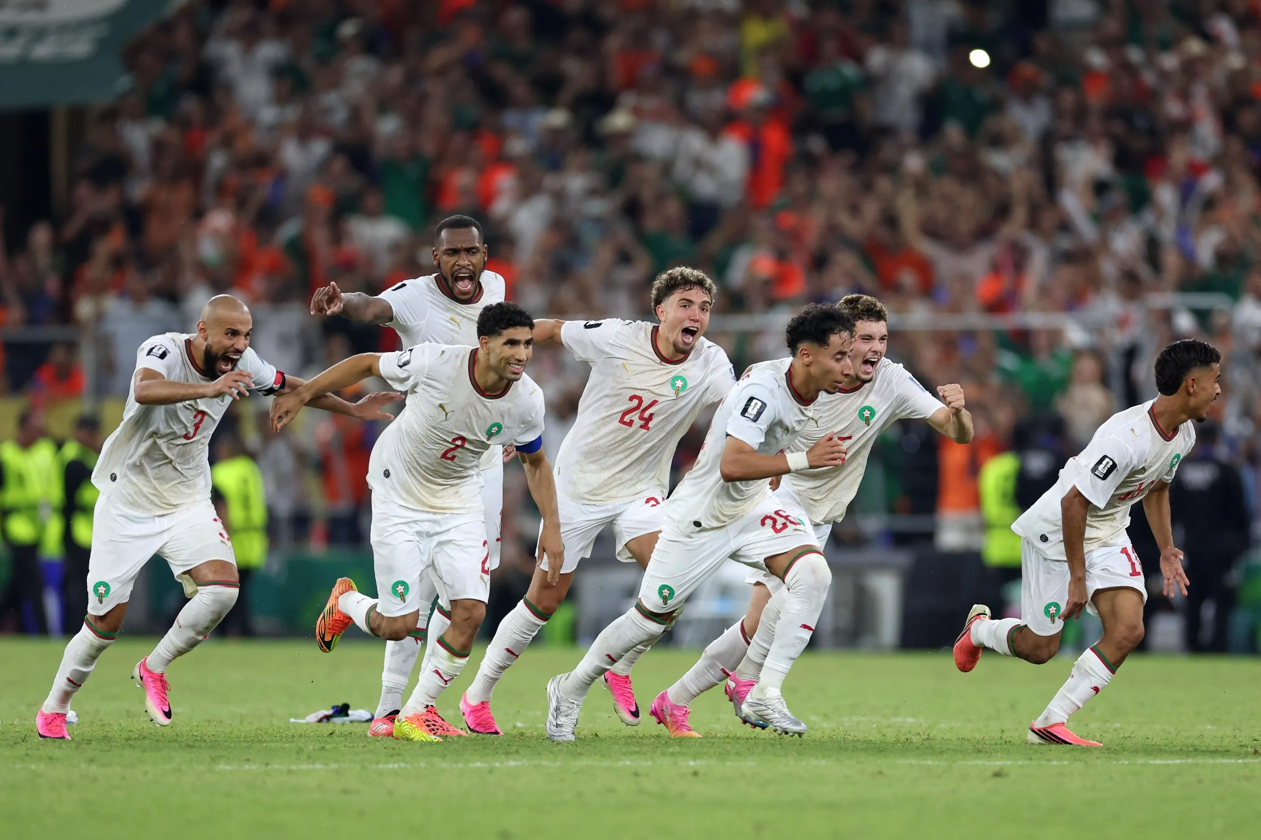 Morocco players set off after Ismael Saibari at the conclusion of the shootout.