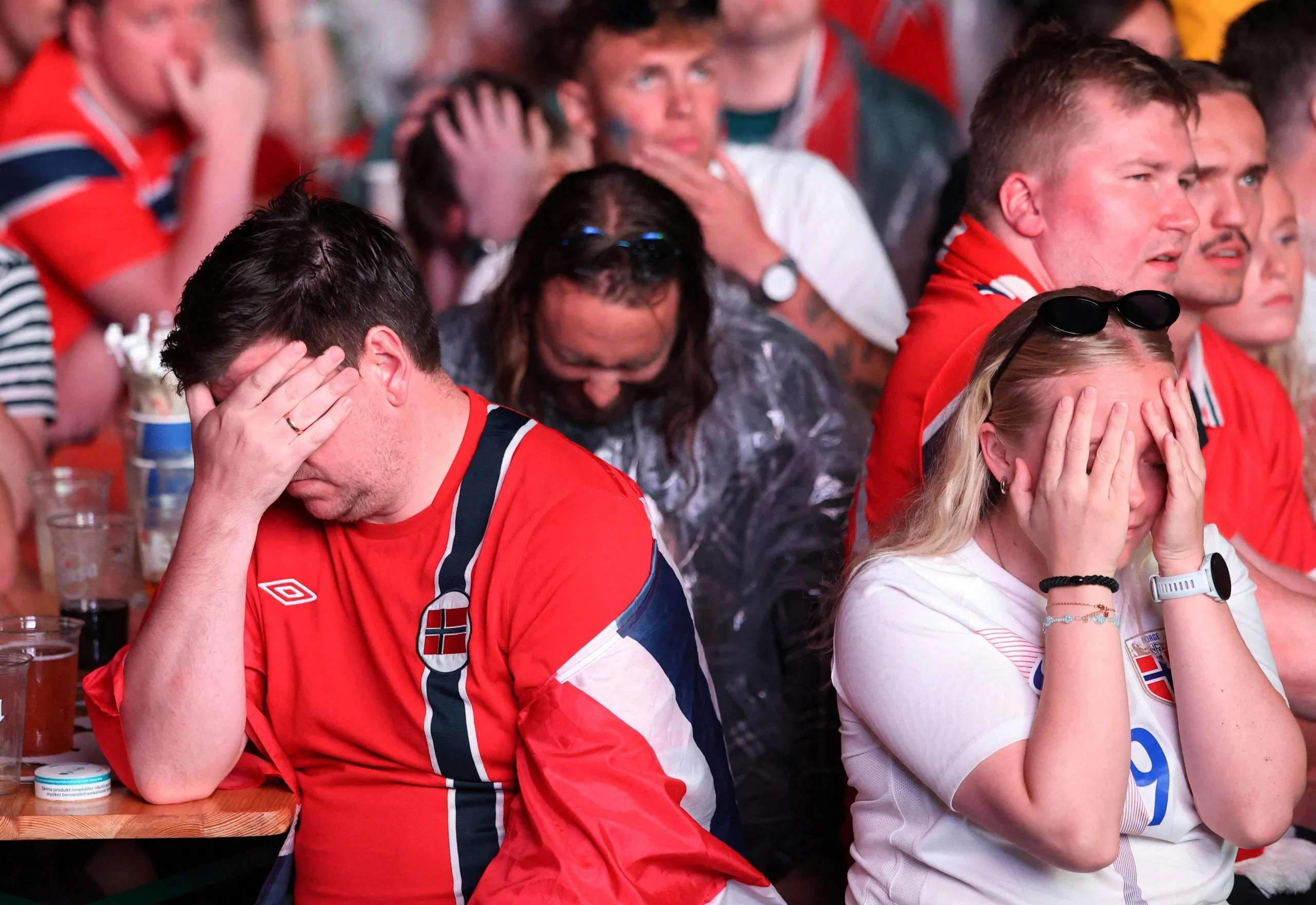 Norway fans gathered in Oslo cannot bear to look during their team’s defeat to England and subsequent World Cup exit.