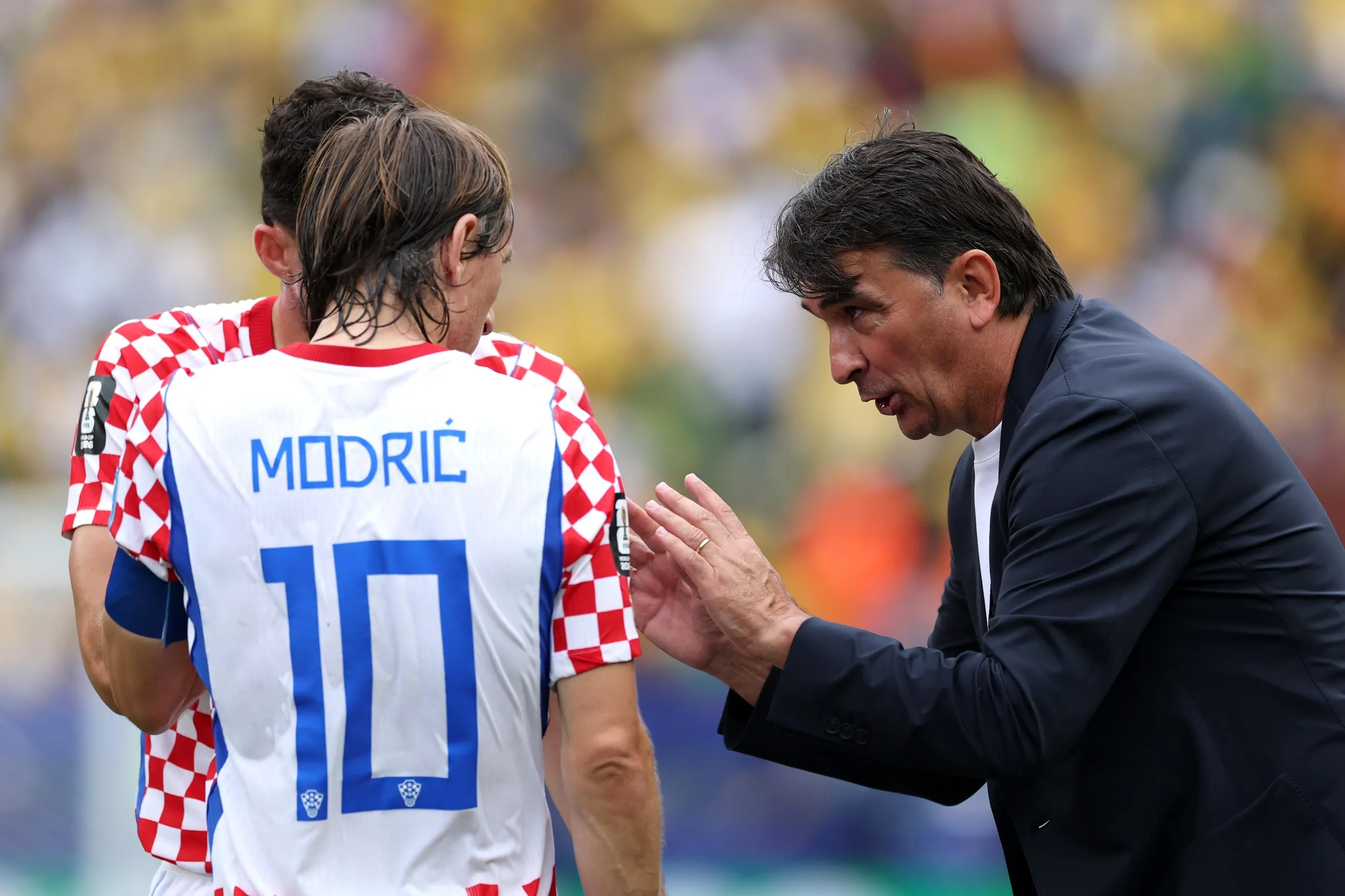 Zlatko Dalic, head coach of Croatia, speaks to Luka Modric during the match against Ghana.