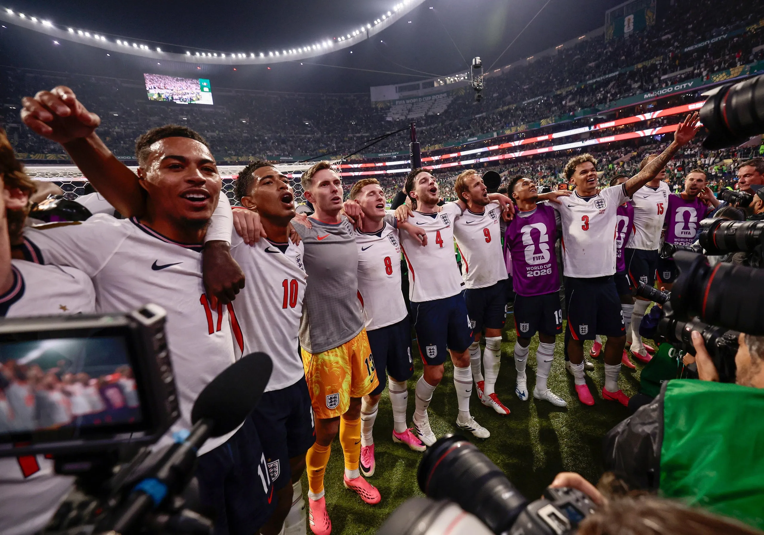 England’s players sing Wonderwall with in front of their fans after their last-16 victory over Mexico.