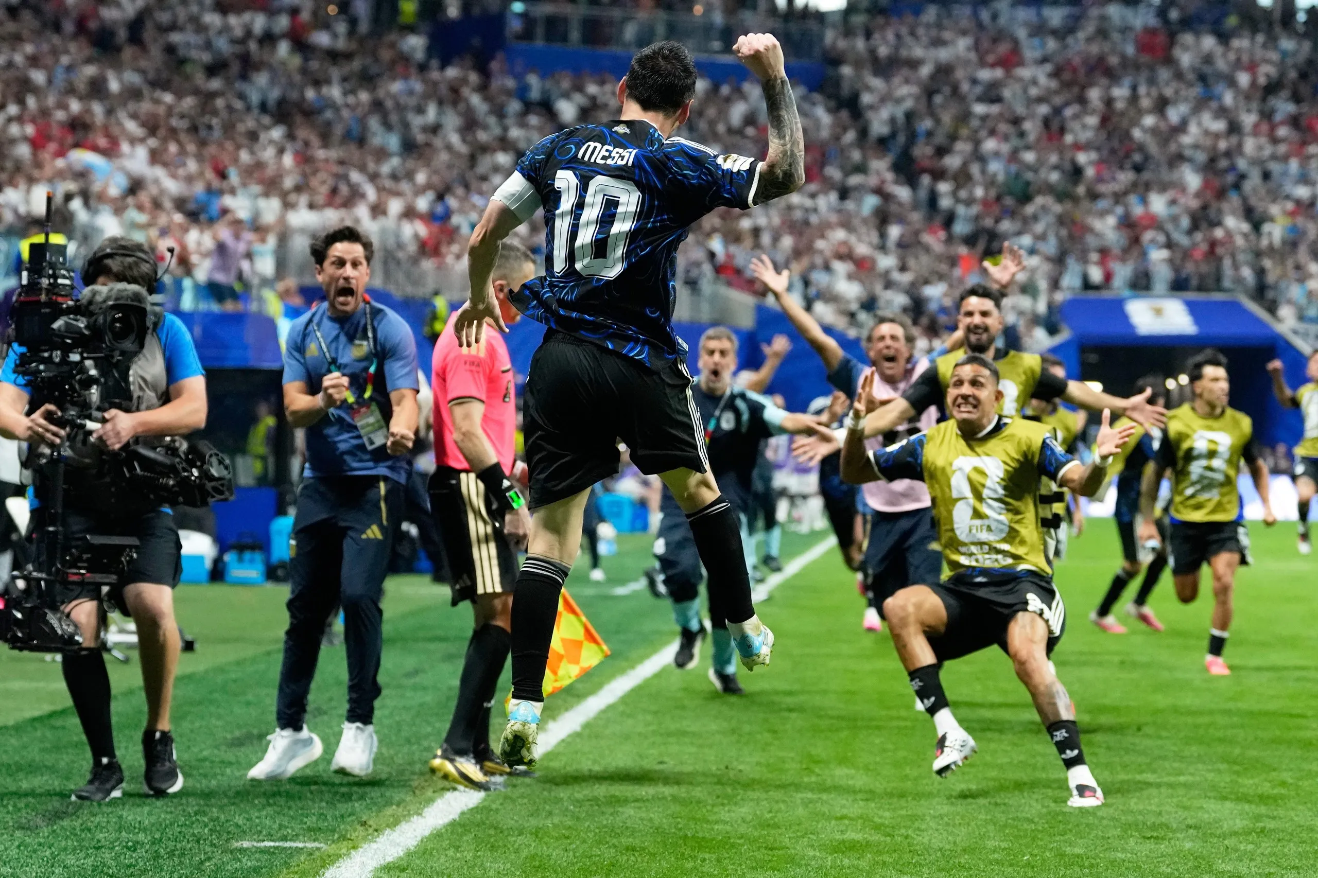 Lionel Messi celebrates after providing the cross for Lautaro Martínez to score Argentina’s winner