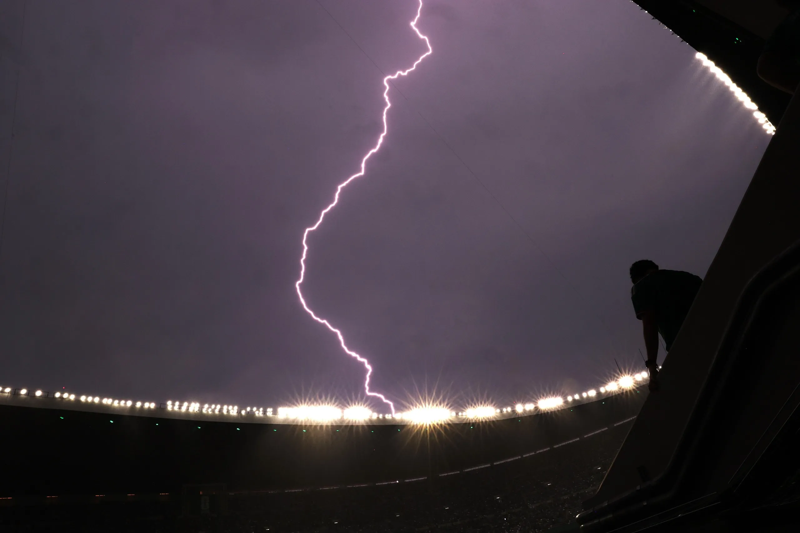 General view inside the Azteca Stadium as lightning is seen during a weather delay at the Mexico City Stadium.