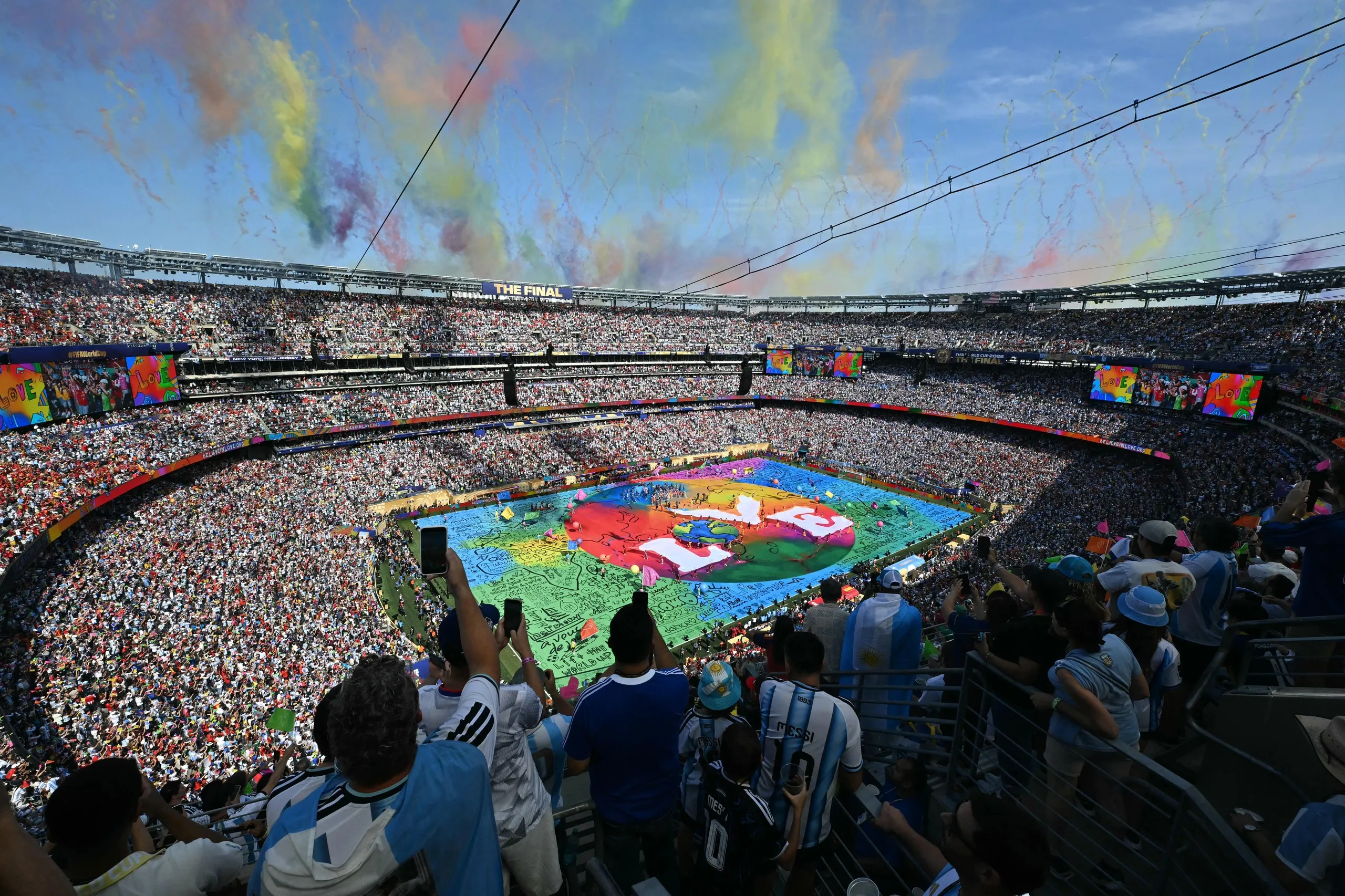 Fans watch the half-time show at the New York New Jersey Stadium.